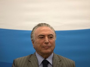 Brazil's president Michel Temer attends a ceremony at the Brain Institute in Rio de Janeiro, Brazil, Friday, Sept. 15, 2017. Temer has been charged with obstruction of justice and of leading a criminal organization in the latest fallout from a wide-ranging corruption probe that has ensnared many of the elite in Latin America's largest nation. (AP Photo/Leo Correa)