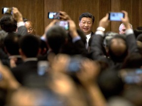 Chinese President Xi Jinping, center, arrives for the opening ceremony of the BRICS Business Forum at the Xiamen International Conference and Exhibition Center in Xiamen in southeastern China's Fujian Province, Sunday, Sept. 3, 2017. (AP Photo/Mark Schiefelbein, Pool)