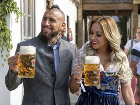 Munich soccer player Arturo Vidal arrives with his wife Maria Teresa Matus  at the Oktoberfest in Munich, Germany, Saturday, Sept. 23, 2017. The Bayern Munich squad visited the traditional beer festival on Saturday. (Matthias Balk/dpa via AP)