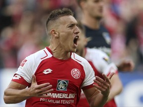 Mainz's Pablo de Blasis celebrates after giving his side a 1-0 lead during the German Bundesliga match between FSV Mainz 05 and Hertha BSC Berlin  in Mainz, Germany, Saturday, Sept. 23, 2017.  (Thomas Frey/dpa via AP)