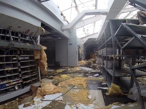 In this image made from video shows a damage to a post office caused by Hurricane Irma in St. Thomas, U.S. Virgin Islands, Thursday, Sept. 7, 2017. Hurricane Irma weakened slightly Thursday with sustained winds of 175 mph, according to the National Hurricane Center. The storm boasted 185 mph winds for a more than 24-hour period, making it the strongest storm ever recorded in the Atlantic Ocean. The storm was expected to arrive in Cuba by Friday. It could hit the Florida mainland by late Saturday, according to hurricane center models. (AP Photo/Ian Brown)