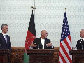 Afghan President Ashraf Ghani, center, speaks during a press conference with U.S. Defense Secretary Jim Mattis, right, and NATO Secretary General Jens Stoltenberg at the presidential palace in Kabul, Afghanistan, Wednesday, Sept. 27, 2017. (AP Photo/Rahmat Gul)