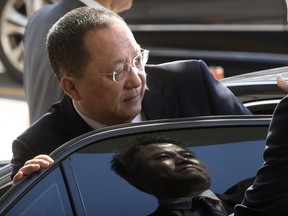 FILE - In this Sept. 19, 2017, file photo, North Korean Foreign Minister Ri Yong Ho gets into a car at Beijing Capital International Airport in Beijing. Ri in New York on Wednesday, Sept. 20, 2017, described as "the sound of a dog barking" U.S President Donald Trump's threat to destroy his country. The comments are the North's first response to Trump's speech at the U.N. General Assembly. (AP Photo/Mark Schiefelbein, File)