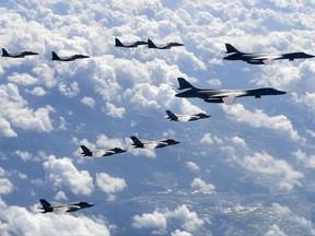 U.S. B-1B bombers, F-35B stealth fighters and South Korean F-15K fighter jets fly over the Korean Peninsula during joint drills on Sept. 18, 2017, in this photo provided by South Korea Defence Ministry.