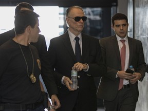 FILE - In this Sept. 5, 2017 file photo, Carlos Nuzman, president of the Brazilian Olympic committee, arrives at Federal Police headquarters in Rio de Janeiro, Brazil. ON Wednesday, Sept. 13, 2017 a former member of the Brazilian Olympic committee showed the Associated Press letters he sent to the IOC eight years ago warning against awarding the games to Rio de Janeiro, and cautioning against the administration of Carlos Nuzman. (AP Photo/Leo Correa, File)