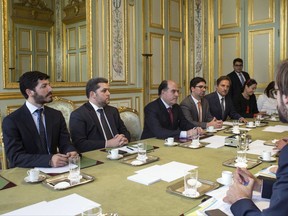 Venezuelan leading opposition activist, Roberto Patino, left, President of the Venezuelan parliament, Julio Borges, third from left, and vice president of the Venezuelan parliament, Freddy Guevara, fourth from left, attend a meeting with France's President Emmanuel Macron, at the Elysee Palace, in Paris, Monday, Sept. 4, 2017.