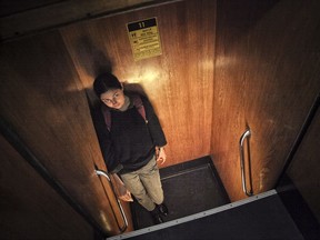 A girl rides on a a paternoster elevator in Prague, Czech Republic, Thursday, Sept. 7, 2017. For visitors to Prague, the recent opening of a rooftop terrace on the Art Nouveau Lucerna Palace building offers a double attraction: a sweeping rooftop view of the old town, and a rare ride in a paternoster _ a cyclic elevator with no doors that works on a circuit and never stops moving, a relic from a time when safety regulations were more lax, invented in the late 19th century, of which only about 200 to 300 are still in use in central and eastern Europe. (AP Photo/Adam Pemble)