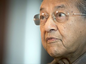In this Sept. 15, 2017 photo, former Malaysian Prime Minister Mahathir Mohamad speaks during an interview in Kuala Lumpur, Malaysia. Mahathir said in an Associated Press interview the opposition alliance campaigning to topple the country's corruption-tainted leader can win the next general elections and pull Malaysia back from a slide into kleptocracy. (AP Photo/Vincent Thian)