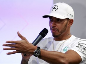 Mercedes driver Lewis Hamilton of Britain answers a question during the Mercedes AMG Petronas press conference at Suria KLCC in Kuala Lumpur, Malaysia on Tuesday, Sept. 26, 2017. (AP Photo/Daniel Chan)