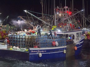 Lobster boats head to drop their traps from Digby, N.S. on Saturday, Oct. 14, 2017.