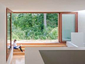 The large windows open up to plenty of green space.