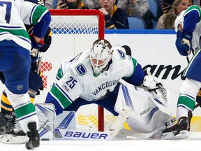 Jacob Markstrom of the Vancouver Canucks makes a pad save on a Sabres shot during the third period at the KeyBank Center in Buffalo on Friday night. The Canucks beat the Sabres 4-2.