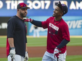 Cleveland Indians' Jason Kipnis, left, chats with teammate Francisco Lindor before Game 1 of the American League Division Series against the New York Yankees on Thursday, Oct. 5, 2017.