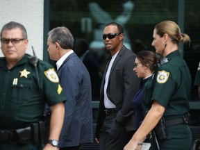 Tiger Woods leaves the North County Courthouse after pleading guilty to a charge of reckless driving on Oct. 27, 2017 in Palm Beach Gardens, Florida.