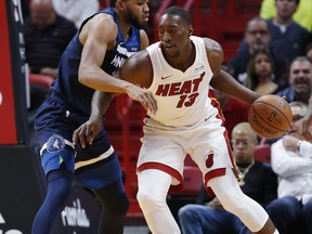 Miami Heat forward Bam Adebayo, right, drives up against Minnesota Timberwolves center Karl-Anthony Towns, left, during the first half of an NBA basketball game, Monday, Oct. 30, 2017, in Miami. (AP Photo/Wilfredo Lee)