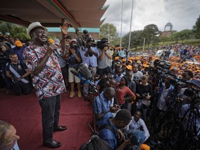 Kenyan opposition leader Raila Odinga speaks to gathered supporters and media at a rally in Uhuru Park in downtown Nairobi, Kenya, Wednesday, Oct. 25, 2017. Odinga urged his supporters to boycott a rerun of the country's disputed presidential election scheduled for Thursday amid rising political tensions and fears of violence, and called on his political coalition to become a "resistance movement". (AP Photo/Ben Curtis)