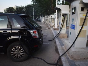 A BYD electric car charges up in Beijing. China is getting set to ban petrol and diesel cars, a move that would boost electric vehicles and shake up the auto industry in the world's biggest but pollution-plagued market.