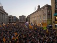 People gather in front of the 'Generalitat' (Catalan government headquarters) to celebrate the proclamation of a Catalan republic at the Sant Jaume square in Barcelona on October 27, 2017.
