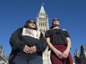 Diane Desmond, left, and Cassandra Desmond speak with the media outside Parliament in Ottawa on Friday October 20, 2017. Cassandra Desmond is bringing her call for an inquiry into the circumstances around her brother's death to the steps of Parliament, in hopes of preventing a repeat of the tragedy that ripped her family apart. THE CANADIAN PRESS/Adrian Wyld