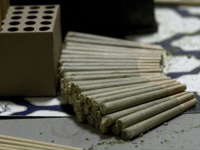 This April 18, 2017, photo shows pre-rolled marijuana cigarettes at GoodSinse Marijuana retail and cultivation facility in Fairbanks, Alaska. Voters in parts of Alaska will decide in local elections on Tuesday, Oct. 3, whether to ban commercial cannabis operations, including retail stores and cultivation facilities. (Eric Engman/Fairbanks Daily News-Miner via AP)