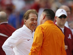 Alabama head coach Nick Saban, left, and Tennessee head coach Butch Jones talk before an NCAA college football game, Saturday, Oct. 21, 2017, in Tuscaloosa, Ala. (AP Photo/Brynn Anderson)