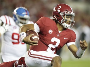 Alabama quarterback Jalen Hurts runs the ball against Mississippi during the first half of an NCAA college football game, Saturday, Sept. 30, 2017, in Tuscaloosa, Ala. (AP Photo/Brynn Anderson)
