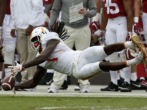Tennessee wide receiver Marquez Callaway misses a pass during the first half an NCAA college football game against Alabama, Saturday, Oct. 21, 2017, in Tuscaloosa, Ala. (AP Photo/Brynn Anderson)