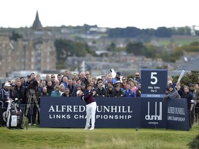 England's Tyrrell Hatton tees off on the fifth hole, during day four of the Dunhill Links Championship at The Old Course at St. Andrews, in Fife, Scotland, Sunday Oct. 8, 2017. (Mark Runnacles/PA via AP)