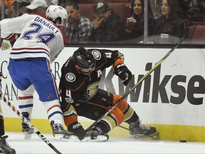 Anaheim Ducks defenseman Cam Fowler, right, is injured as he gets a stick caught in his skate during the first period of an NHL hockey game against the Montreal Canadiens, Friday, Oct. 20, 2017, in Anaheim, Calif. (AP Photo/Mark J. Terrill)