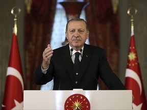 Turkey's President Recep Tayyip Erdogan speaks after D-8 Summit meeting in Istanbul, Friday, Oct. 20, 2017. Turkey hosts summit of "Developing 8" group, including Bangladesh, Egypt, Indonesia, Iran, Malaysia, Nigeria, Pakistan and Turkey. (Pool photo via AP)