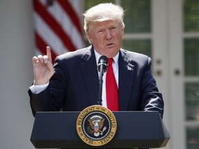 In this Thursday, June 1, 2017 file photo, U.S. President Donald Trump speaks about the U.S. role in the Paris climate change accord in the Rose Garden of the White House in Washington.