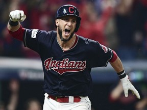 Yan Gomes of the Indians celebrates after hitting a game-winning single off New York Yankees relief pitcher Dellin Betances in the 13th inning of Game 2 of the American League Division Series on Friday night in Cleveland. The Indians won 9-8.
