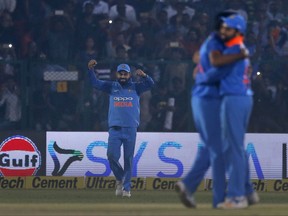 Indian cricket captain Virat Kohli, left, and other players celebrate their victory over New Zealand's in their third one-day international cricket match in Kanpur, India, Sunday, Oct. 29, 2017. (AP Photo/Altaf Qadri)