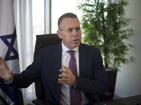 Israeli Public Security Minister Gilad Erdan speaks during an interview with The Associated Press in his office in Bnei Brak, east Tel Aviv, Thursday, Oct. 26, 2017. Erdan told The Associated Press Thursday that a boycott against part of Israel is a boycott against all of Israel. (AP Photo/Ariel Schalit)