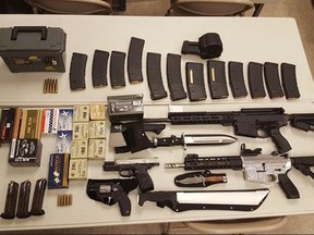 In this undated photo released by the Washington County Sheriff's office, a cache of weapons is displayed in Johnson City Tenn. Federal agents are trying to determine why Scott Edmisten, a man pulled over for speeding in Tennessee, was carrying a cache of weapons including two submachine guns and hundreds of rounds of ammunition. (Washington County Sheriff via AP)
