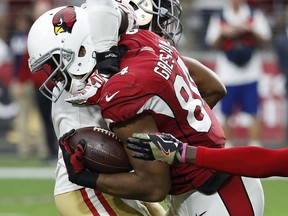 Arizona Cardinals tight end Jermaine Gresham, right, is hit by San Francisco 49ers free safety Jaquiski Tartt during the second half of an NFL football game, Sunday, Oct. 1, 2017, in Glendale, Ariz. (AP Photo/Rick Scuteri)