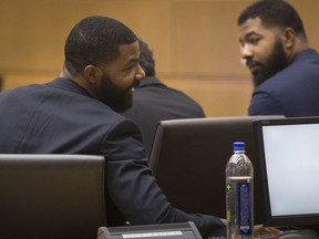 Marcus Morris, left, and Markieff Morris attend closing arguments Monday, Oct. 2, 2017, in Maricopa County Superior Court in Phoenix. The Morris brothers are accused of helping three other people beat Erik Hood two years ago. (Mark Henle/The Arizona Republic via AP)