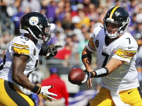 Pittsburgh Steelers quarterback Ben Roethlisberger (7) hands off the ball to running back Le'Veon Bell (26) during the first half of an NFL football game against the Baltimore Ravens in Baltimore, Sunday, Oct. 1, 2017. (AP Photo/Alex Brandon)