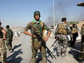 Iraqi security forces and Popular Mobilization Forces patrol in Tuz Khormato, that was evacuated by Kurdish security forces, 130 miles (210 kilometers) north of Baghdad, Iraq, Monday, Oct. 16, 2017. Two weeks after fighting together against the Islamic State, Iraqi forces pushed their Kurdish allies out of the disputed city of Kirkuk on Monday, seizing oil fields and other facilities amid soaring tensions over last month's Kurdish vote for independence. (AP Photo)