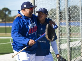 In this Feb. 17 file photo, Toronto Blue Jays bench coach DeMarlo Hale (left) jokes around with pitcher Marcus Stroman at spring training in Dunedin, Fla.