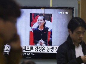 FILE - In this Nov. 27, 2014, file photo, an image of North Korean leader Kim Jong Un's younger sister Kim Yo Jong is shown on a screen broadcasting a TV news program at Seoul Railway Station in Seoul, South Korea. Kim Jong Un has promoted his younger sister to a new post within North Korea's ruling party. The promotion of Kim Yo Jong came at a meeting of the party as North Korea marked the 20th anniversary of the late Kim Jong Il's acceptance of the title of general secretary of the ruling Worker's Party of Korea. The letters read: "Kim Jong Un's sister." (AP Photo/Ahn Young-joon, File)