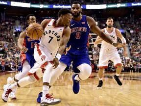 Toronto Raptors guard Kyle Lowry attempts to drive past Detroit Pistons centre Andre Drummond during an NBA pre-season game in Toronto on Tuesday, Oct. 10, 2017.