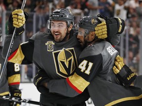 Vegas Golden Knights forwards William Carrier (left) and Pierre-Edouard Bellemare celebrate a goal against the Chicago Blackhawks on Oct. 26.