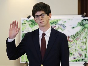 FILE - In this Aug. 26, 2015, file photo, St. Paul's School graduate Owen Labrie raises his hand to be sworn-in prior to testifying in his trial at Merrimack Superior Court in Concord, N.H. The New Hampshire Supreme Court says it will hear an appeal for a new trial from a prep school graduate who was convicted in 2015 of sexually assaulting a classmate. (AP Photo/Charles Krupa, Pool, File)
