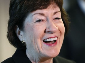 FILE - In this Sept. 29, 2017, file photo, Sen. Susan Collins, R-Maine, speaks at a news conference at Bath Iron Works in Bath, Maine. Collins said she will decide during the Columbus Day recess whether to stay in the U.S. Senate or again run for governor in Maine. (AP Photo/Robert F. Bukaty, File)