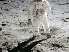 In this 1969 photo released by NASA, astronaut Buzz Aldrin walks on the surface of the moon near the leg of the lunar module Eagle during the Apollo 11 mission. Astronaut Neil Armstrong, who took the photograph, is reflected in Aldrin's visor. From Thursday, Oct. 12, 2017 through Nov. 2., Skinner Auctioneers and Appraisers is selling more than 400 vintage prints of photos, including the photo of Aldrin, made by American astronauts from 1961 to 1972. (Neil Armstrong/NASA via AP)