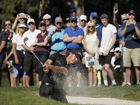 Phil Mickelson hits out of a bunker onto the seventh green of the Silverado Resort North Course during the second round of the Safeway Open PGA golf tournament Friday, Oct. 6, 2017, in Napa, Calif. (AP Photo/Eric Risberg)