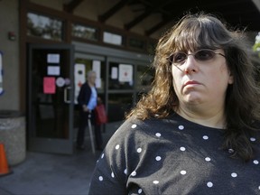 Jessica Tunis stands outside a Red Cross evacuation center Wednesday, Oct. 11, 2017, in Santa Rosa, Calif. Tunis is searching for her missing mother, Linda Tunis, who was living at a mobile home park when wildfires struck. (AP Photo/Eric Risberg)