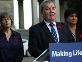 Minister of Social Development and Poverty Reduction Shane Simpson is joined by UNBC chair Dawn Hemingway, (left), and Parliamentary Secretary and co-chair Mable Elmore as they discuss details of an advisory forum on poverty reduction during a press conference from the Rose Garden at Legislature in Victoria, B.C., on Monday, October 30, 2017. THE CANADIAN PRESS/Chad Hipolito