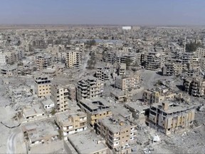 This Thursday, Oct. 19, 2017 frame grab made from drone video shows damaged buildings in Raqqa, Syria two days after Syrian Democratic Forces said that military operations to oust the Islamic State group have ended and that their fighters have taken full control of the city. (AP Photo/ Gabriel Chaim)